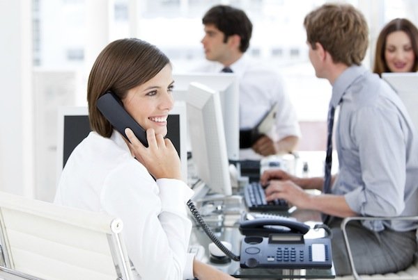 Enthousiastic businesswoman talking to the phone